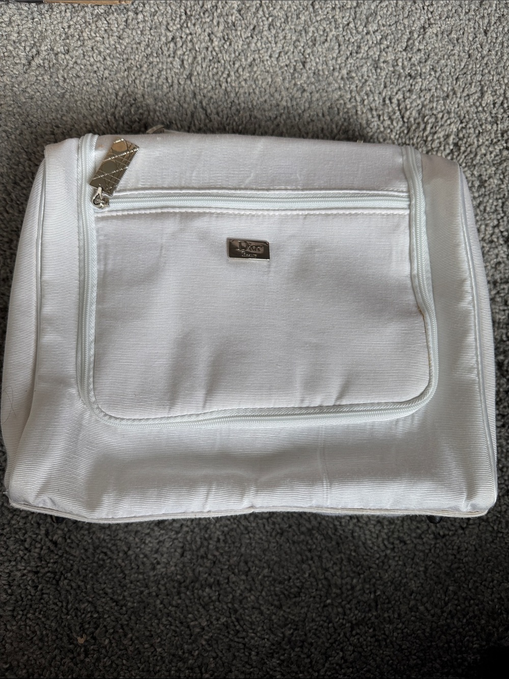 Dior Silver Logo on White Textured Cosmetic Bag